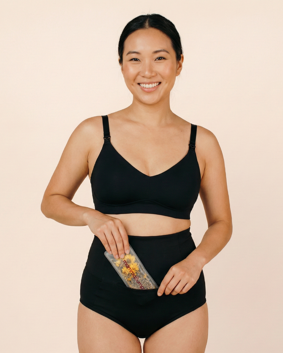 Hand placing a hot and cold insert into postpartum soothing briefs