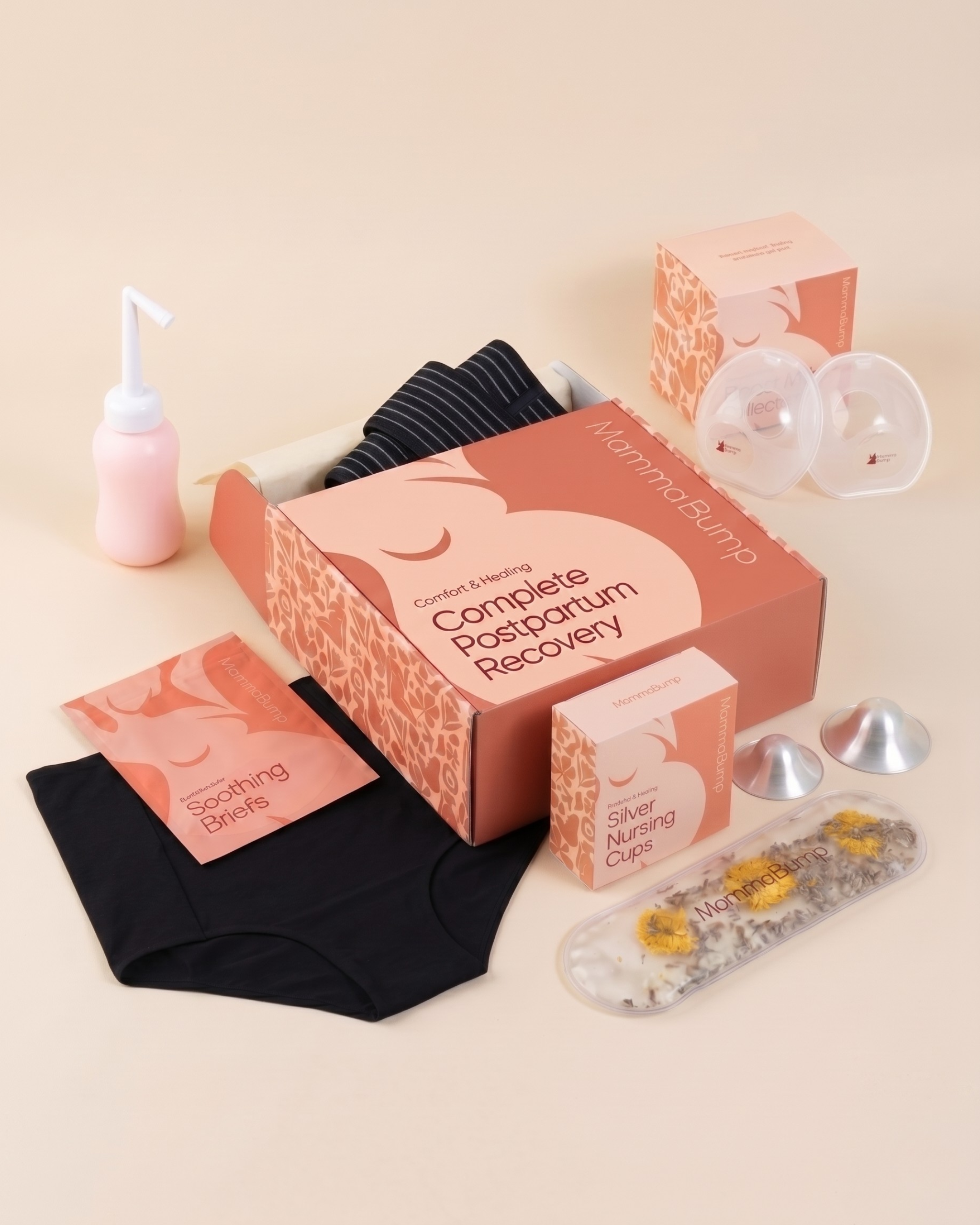 MammaBump Complete Postpartum Recovery Bundle packaging with belly band, two soothing briefs, peri bottle, perineal therapy pack, silver nursing cups, and breast milk collectors
