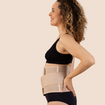 Side profile of a new mum wearing the tan MammaBump Postpartum Belly Band, showing gentle abdominal and lower back support during postpartum recovery